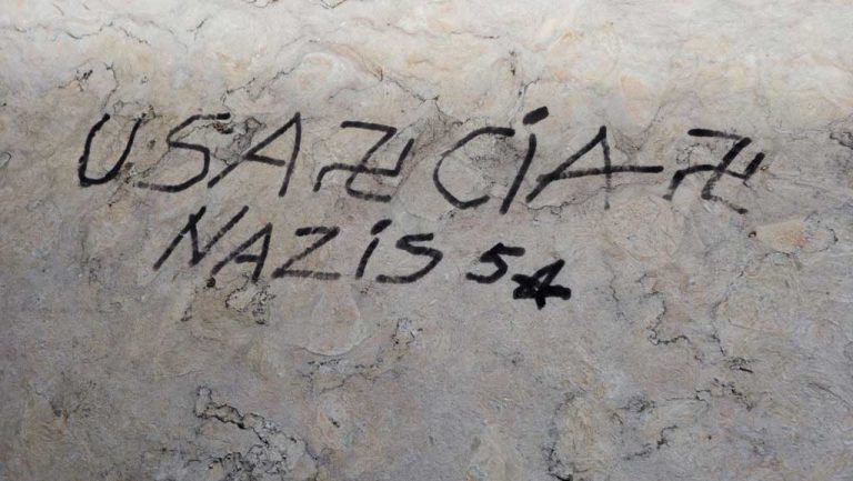 Racist graffiti in a bathroom at Riverside-Brookfield