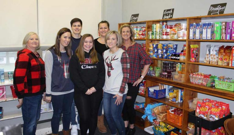 Staff and students in Red Bud create a food pantry