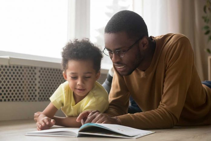 kid-reading-with-dad
